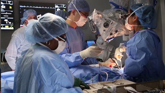 Operating room with doctor and 2 surgical nurses